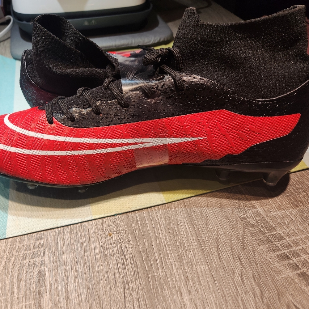 NWT. Mens Red and Black Soccer Cleats. Size 47.